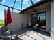 Covered patio offers peaceful views, stylish pavers and comfortable seating at 15974 Clear Skies Pl, Bradenton, FL 34211