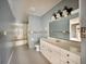 Bathroom featuring tiled floors, vanity with sink, and shower-tub combination at 1611 Robbins Rd, Nokomis, FL 34275