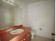 Bathroom features a single sink vanity with a toilet at 1611 Robbins Rd, Nokomis, FL 34275
