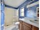 Bathroom with faux textured walls, glass shower, and anchor-themed decor at 1611 Robbins Rd, Nokomis, FL 34275