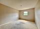 Neutral bedroom featuring carpet, a window, and natural light at 1611 Robbins Rd, Nokomis, FL 34275