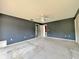 Bedroom featuring carpet, a ceiling fan, and access to other rooms at 1611 Robbins Rd, Nokomis, FL 34275