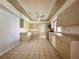 Bright kitchen featuring tile floors, lots of cabinet space, and modern appliances at 1611 Robbins Rd, Nokomis, FL 34275