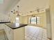 Bright eat-in kitchen featuring tile floors and plenty of natural light at 1611 Robbins Rd, Nokomis, FL 34275