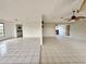 Open-concept living space with tile flooring and access to the kitchen at 1611 Robbins Rd, Nokomis, FL 34275