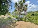 Scenic waterfront view of a tranquil canal with docks and boats at 1611 Robbins Rd, Nokomis, FL 34275