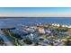 An aerial view shows a marina, waterfront dining and parks on a sunny day by the bay at 1801 Los Alamos Dr, Punta Gorda, FL 33950