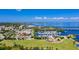 Expansive aerial view showcasing the waterfront marina, park, and downtown area with stunning water views and blue skies at 1801 Los Alamos Dr, Punta Gorda, FL 33950