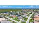 Stunning aerial view of the property showcasing lush landscaping, waterfront access, and a desirable neighborhood at 1801 Los Alamos Dr, Punta Gorda, FL 33950