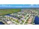 Waterfront homes boast private docks along canals in a beautiful coastal community near lush green foliage and the ocean at 1801 Los Alamos Dr, Punta Gorda, FL 33950