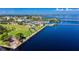 Stunning waterfront views from above overlooking the boat docks, waterfront park, and the beautiful blue water at 1801 Los Alamos Dr, Punta Gorda, FL 33950