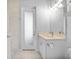 A clean bathroom with a spacious vanity, ample lighting, and large shower at 1801 Los Alamos Dr, Punta Gorda, FL 33950