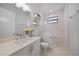 Bright bathroom with modern vanity, stylish mirror, and a spacious walk-in shower at 1801 Los Alamos Dr, Punta Gorda, FL 33950