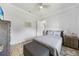 Cozy bedroom featuring a double bed, wood-look floors, and ceiling fan at 1801 Los Alamos Dr, Punta Gorda, FL 33950