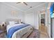 A cozy bedroom featuring a comfortable bed, ceiling fan, and closet at 1801 Los Alamos Dr, Punta Gorda, FL 33950