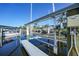 Residential boat lift on canal, providing convenient access to the water and boating activities at 1801 Los Alamos Dr, Punta Gorda, FL 33950