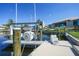 Residential boat lift on canal, providing convenient access to the water and boating activities at 1801 Los Alamos Dr, Punta Gorda, FL 33950
