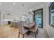 Open concept dining area with seating for six, view of the outdoor space, and access to kitchen at 1801 Los Alamos Dr, Punta Gorda, FL 33950