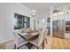 Dining room featuring a modern chandelier, a large window, and seating for six at 1801 Los Alamos Dr, Punta Gorda, FL 33950