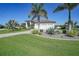 Beautiful home with a three car garage, landscaped yard, stone accents and a paver driveway at 1801 Los Alamos Dr, Punta Gorda, FL 33950