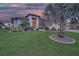 Well-manicured front lawn and landscaping adds to the curb appeal of this residence at 1801 Los Alamos Dr, Punta Gorda, FL 33950