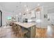 Bright kitchen with an island, bar seating, stainless appliances, and an open layout to dining area at 1801 Los Alamos Dr, Punta Gorda, FL 33950