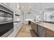 Modern kitchen with stainless steel appliances, a gas cooktop, and stylish pendant lights at 1801 Los Alamos Dr, Punta Gorda, FL 33950