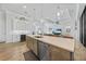 Bright kitchen with stainless steel appliances, pendant lighting, and an expansive island at 1801 Los Alamos Dr, Punta Gorda, FL 33950