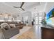 Inviting living room with a comfortable sectional sofa, wood floors, and a seamless open-concept design at 1801 Los Alamos Dr, Punta Gorda, FL 33950
