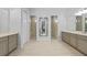 Open main bathroom with separate vanities, large mirror, and walk-in showers at 1801 Los Alamos Dr, Punta Gorda, FL 33950