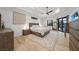 Main bedroom with natural light, neutral tones, wood accents, and access to outdoor spaces at 1801 Los Alamos Dr, Punta Gorda, FL 33950