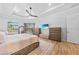 Spacious main bedroom features wood-look floors, neutral decor, and views of the pool at 1801 Los Alamos Dr, Punta Gorda, FL 33950