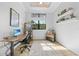 Bright home office with a modern desk, comfortable chair, and natural light at 1801 Los Alamos Dr, Punta Gorda, FL 33950