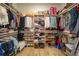 Custom walk-in closet with built-in shelving and ample storage space for clothes and shoes at 1801 Los Alamos Dr, Punta Gorda, FL 33950