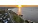 Breathtaking waterfront view featuring a park, pier, and golden sunset at 1801 Los Alamos Dr, Punta Gorda, FL 33950