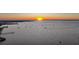 Incredible waterfront view with many boats and a golden sunset at 1801 Los Alamos Dr, Punta Gorda, FL 33950