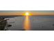 Gorgeous waterfront view with many boats on the water at sunset at 1801 Los Alamos Dr, Punta Gorda, FL 33950
