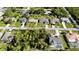An aerial view of a residential neighborhood featuring well-maintained homes and lush landscaping at 18335 Oxford Ave, Port Charlotte, FL 33948