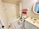 Bathroom with a tiled shower-tub, vanity, and neutral color palette, creating a clean and functional space at 18335 Oxford Ave, Port Charlotte, FL 33948