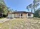 Charming single-story home with a well-maintained lawn and inviting curb appeal under a clear blue sky at 18335 Oxford Ave, Port Charlotte, FL 33948