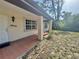 Covered porch with sturdy support columns and a view of the front yard at 18335 Oxford Ave, Port Charlotte, FL 33948