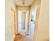 Hallway featuring multiple doors leading to other rooms within the home at 18335 Oxford Ave, Port Charlotte, FL 33948
