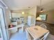 Bright kitchen with a breakfast nook and sliding doors to the backyard at 18335 Oxford Ave, Port Charlotte, FL 33948