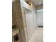 Hallway featuring palm wallpaper, white trim, and multiple closets at 2023 Lynx Run, North Port, FL 34288