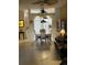 Comfortable living room, ceiling fan, and an open floor plan to the dining area and kitchen at 2023 Lynx Run, North Port, FL 34288
