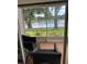 Relaxing screened-in patio with brick flooring overlooking a tranquil lake at 2023 Lynx Run, North Port, FL 34288