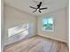 A sunlit bedroom with a ceiling fan and wood laminate floors at 2089 Garnet St, North Port, FL 34288