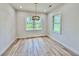 Bright dining room with large windows and modern lighting at 2089 Garnet St, North Port, FL 34288