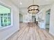 Open concept kitchen and living space with modern finishes and natural light at 2089 Garnet St, North Port, FL 34288
