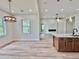 Spacious living room showcases a fireplace, modern light fixtures, and expansive windows at 2089 Garnet St, North Port, FL 34288